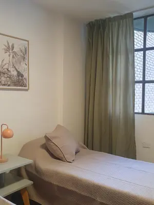 a bedroom with a bed and a window at Cómodo departamento en Nueva Córdoba in Cordoba