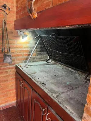 a wire basket sitting on top of a wooden cabinet at La soñada San Antonio de Arredondo in San Antonio de Arredondo