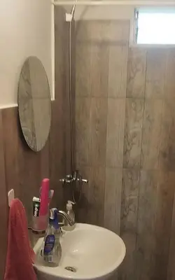 a bathroom with a sink and a shower at Cabaña rio de los sauces in Río de los Sauces