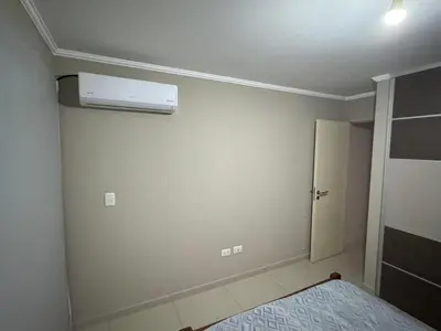 a small bedroom with a air conditioner on the wall at 2point in Río Tercero