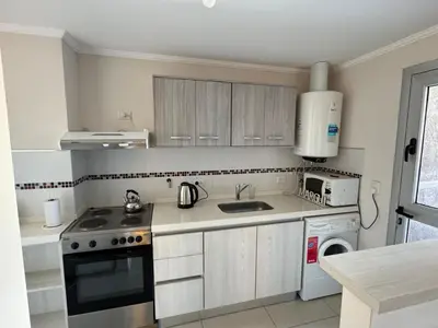 a kitchen with a sink and a stove top oven at 2point in Río Tercero