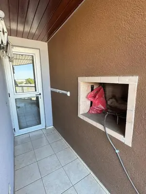 a room with a fireplace in the corner of a wall at 2point in Río Tercero