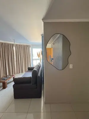 a living room with a couch and a mirror at 2point in Río Tercero