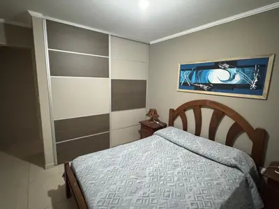 a small bedroom with a bed and a picture on the wall at 2point in Río Tercero