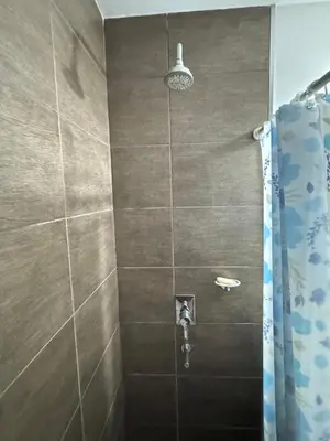 a bathroom with a shower with a shower curtain at 2point in Río Tercero