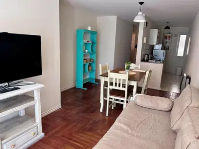 a living room with a couch and a table at Departamento amplio 3 personas Zona Nueva Córdoba in Cordoba