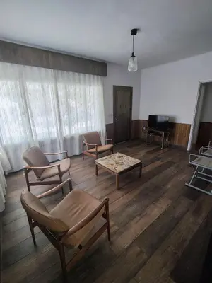 a living room with chairs and a coffee table at Casa Jorge Newbery in Villa Carlos Paz
