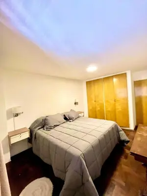 a bedroom with a bed with a ceiling at Departamento amplio 4 personas Zona Nueva Córdoba in Cordoba