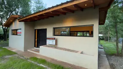 a small house with a large window at Acasias Vcp New in Villa Ciudad Parque
