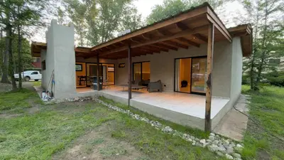 a small house with a patio in the yard at Acasias Vcp New in Villa Ciudad Parque