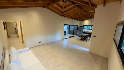 an empty living room with a couch and a table at Acasias Vcp New in Villa Ciudad Parque