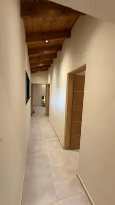 a hallway with a wooden ceiling and a door at Acasias Vcp New in Villa Ciudad Parque