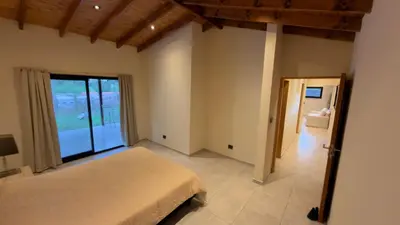 a bedroom with a bed and a large window at Acasias Vcp New in Villa Ciudad Parque