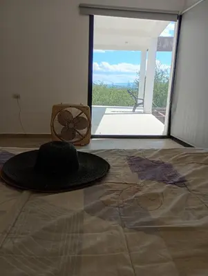 a hat sitting on the floor of a room at Casa en sierras de cordoba in San Roque
