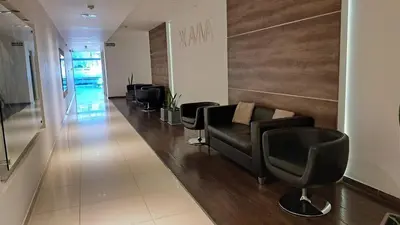 a salon with leather chairs and a waiting room at Dpto a estrenar Asador Pileta Cochera propia Terraza privada con vista a sierras Seguridad 24 hs Av Colón Alberdi Ubicación estratégica H Clínicas Kempes Shopping Carlos Paz in Cordoba