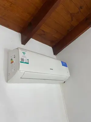 a white object is hanging from a ceiling at Casa terracota in Villa General Belgrano