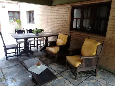 a table and chairs sitting on a patio at Paprikas in Villa Ciudad Parque