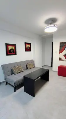 a living room with a couch and a coffee table at Patio Olmos a pasos in Cordoba