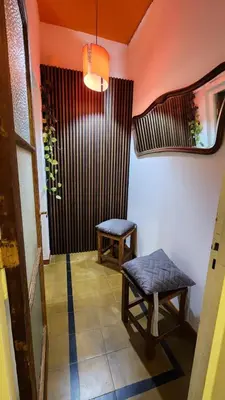 a room with a table and a bench and a window at DPTO ZONA centro in Villa Carlos Paz