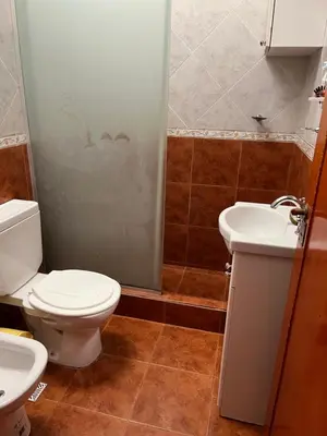 a bathroom with a toilet and a sink and a shower at La Soñada San Antonio de Arredondo in San Antonio de Arredondo