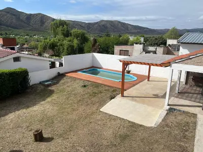 a backyard with a swimming pool and a table at La Soñada San Antonio de Arredondo in San Antonio de Arredondo