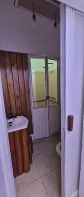 a bathroom with a sink and a toilet at Depto Bodhi Dorado in Villa Carlos Paz