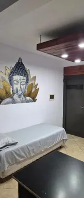 a room with a wall with a statue on the wall at Depto Bodhi Dorado in Villa Carlos Paz