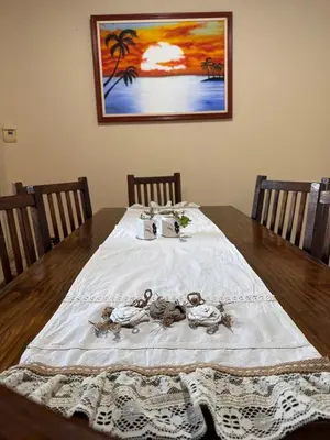 a table with a blanket with dolls on it at Cabañas Antillanca in Luyaba