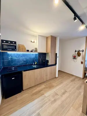 a kitchen with a black counter top in a room at Apartment in Nueva Cba meters from Buen Pastor in Cordoba
