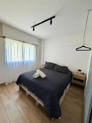 a bedroom with a bed with two towels on it at Apartment in Nueva Cba meters from Buen Pastor in Cordoba