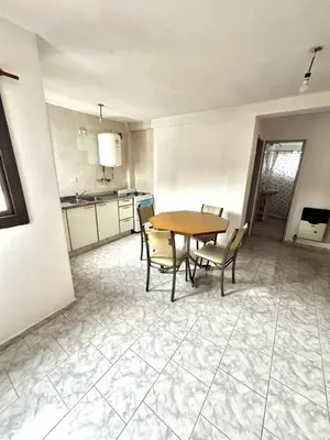 a kitchen and dining room with a table and chairs at alojamiento centrico vcp in Villa Carlos Paz