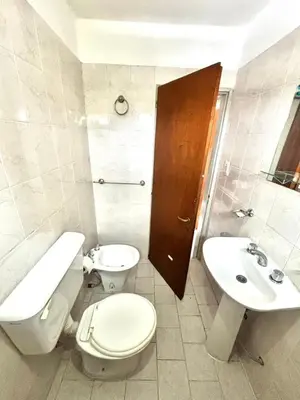 a bathroom with a toilet and a sink at alojamiento centrico vcp in Villa Carlos Paz