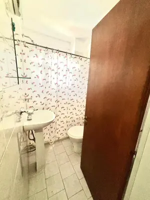 a bathroom with a toilet and a sink at alojamiento centrico vcp in Villa Carlos Paz