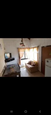 a living room with a couch and a table at Campo Dulce Esperanza in Bialet Massé