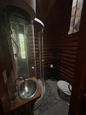 a bathroom with a sink and a toilet at Cabaña con pileta en Villa Carlos Paz in Villa Carlos Paz