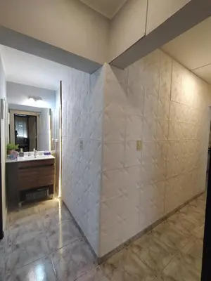 a bathroom with a shower and a sink at Departamento de los Cuadros in Villa Carlos Paz