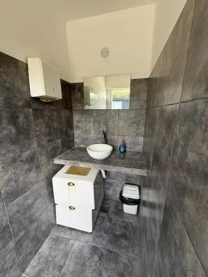 a bathroom with a sink and a mirror at Piedras Moras cabañas in Almafuerte
