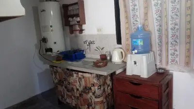 a kitchen with a sink and a counter top at Sierras de Córdoba in Santa María