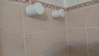 a bathroom with two rolls of toilet paper on the wall at Sierras de Córdoba in Santa María