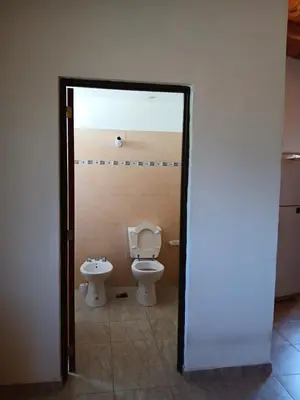 a bathroom with a toilet and a bidet at La soñada in San Antonio de Arredondo