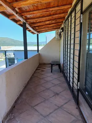 a balcony with a bench on the side of a building at La soñada in San Antonio de Arredondo
