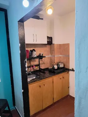 a kitchen with a sink and a counter top at San Martin 40 in Villa Carlos Paz
