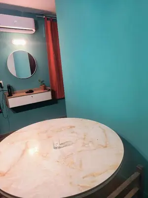 a wooden table in a room with a mirror at San Martin 40 in Villa Carlos Paz