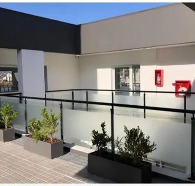a building with potted plants on top of it at Venetto IV in Cordoba