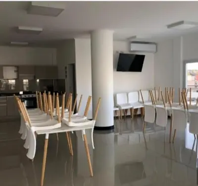 a room with a bunch of chairs and a table at Venetto IV in Cordoba