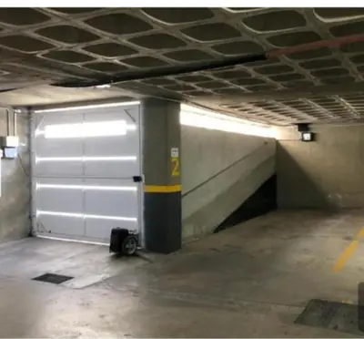 a metal garage door in a parking garage at Venetto IV in Cordoba