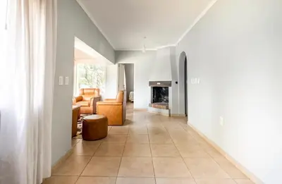 a living room with a couch and a fireplace at Casa D'amico in Villa General Belgrano