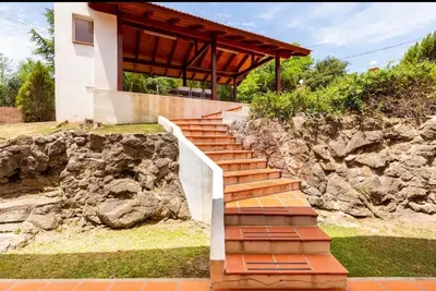 a set of stairs leading up to a house at Casa D'amico in Villa General Belgrano