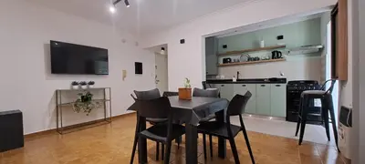 a kitchen and dining room with a table and chairs at Mozzafiato in Cordoba