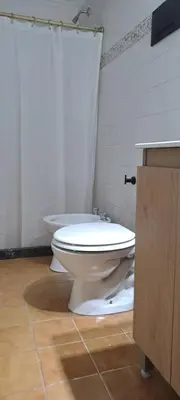 a bathroom with a toilet and a sink at Mozzafiato in Cordoba
